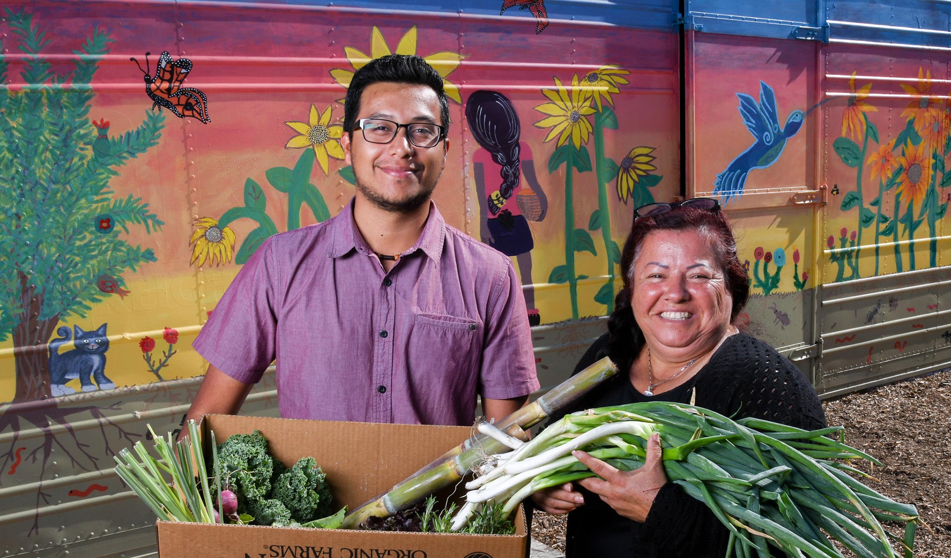 hispanic couple with vegetables